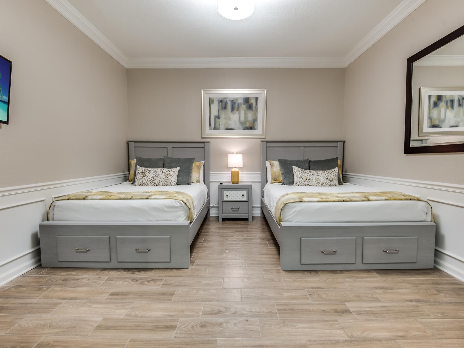 Comfort and companionship await in this two-bed bedroom – where every detail is designed for shared moments and peaceful rest. Embrace the warmth of togetherness in your cozy retreat.