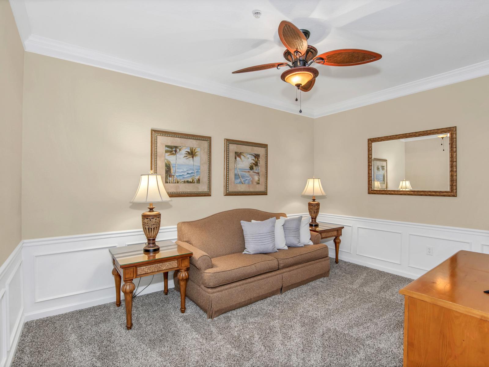 Classy living area of the condo in Orlando Florida - Cozy seating area conducive to relaxation and socializing - Well-chosen lighting fixtures adding both functionality and charm - Smart TV for entertainment