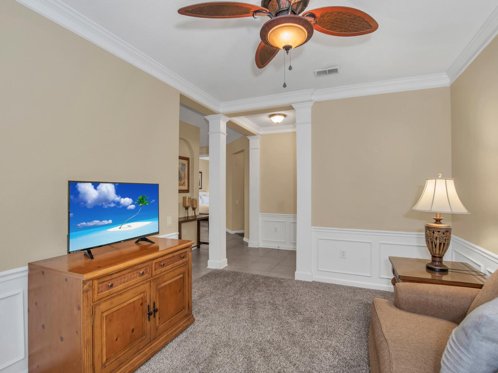 Calming living area of the condo in Orlando Florida - A balance of sophistication and comfort, featuring elegant yet inviting furniture - Living room that effortlessly combines sophistication, comfort, and functionality - Plush sofa for relaxation