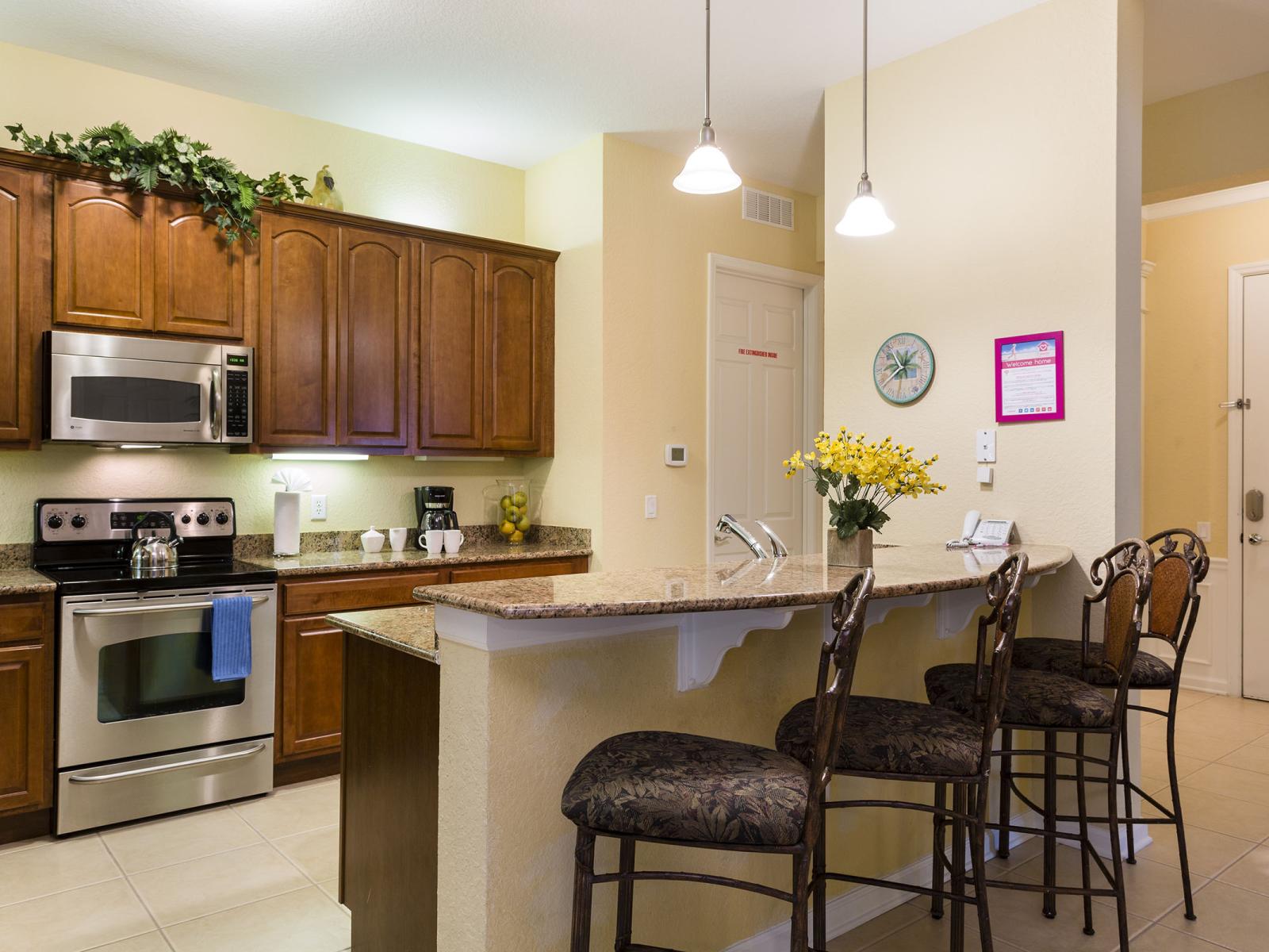 Step into a world of culinary luxury in our open-concept kitchen of the condo in Orlando - Fully furnished with stylish details and equipped with all kitchen accessories that makes cooking a delight - Availability of high chairs at breakfast bar