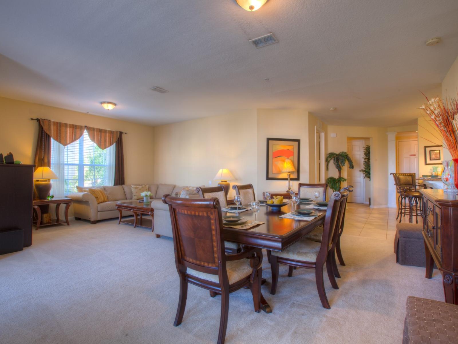 Gather, Dine, and Relax: Embrace the Warmth of our Welcoming Dining and Living Area Adorned with Wooden Furnishings.