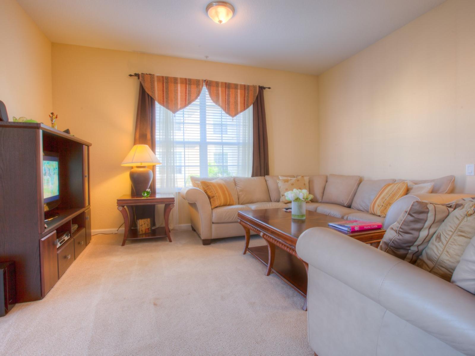 Comfort and Entertainment Meet: Relax in our Inviting Living Room, Perfect for Family Gatherings and Cozy Movie Nights.