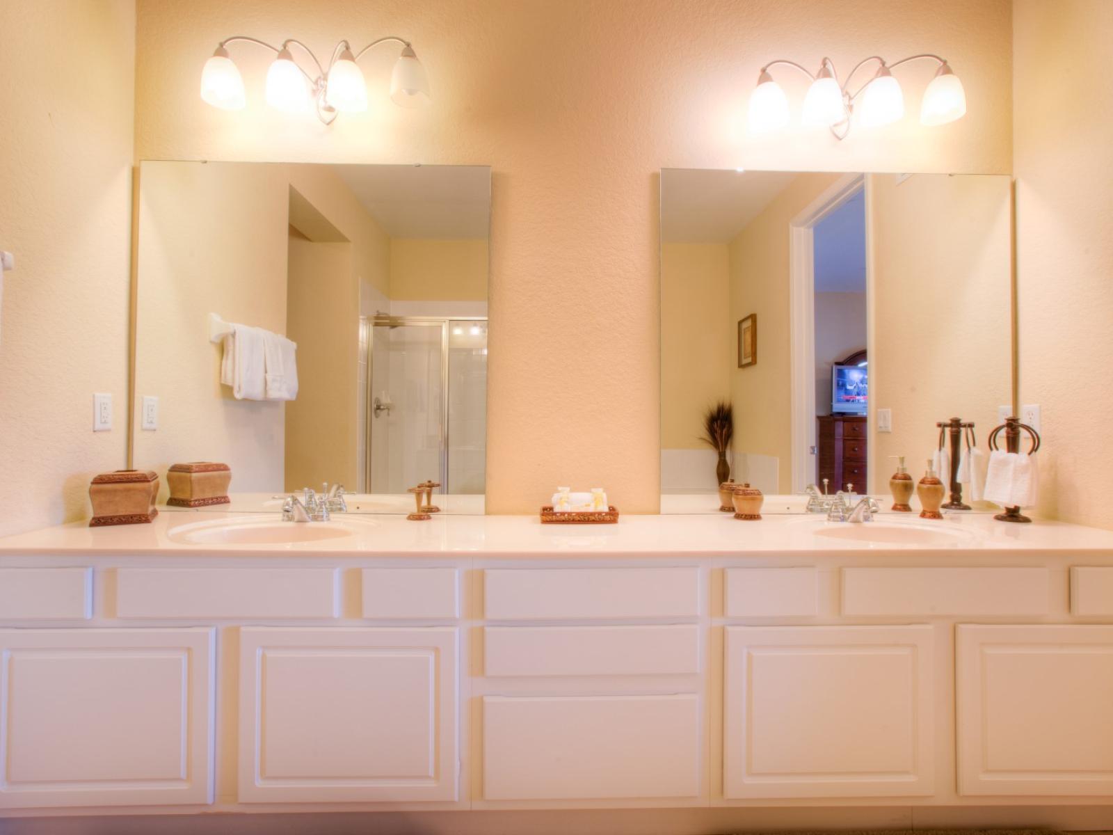 Our bathroom offers modern comfort with its enclosed shower and spacious vanity area. A serene retreat where convenience meets style, promising rejuvenation and relaxation in every moment.