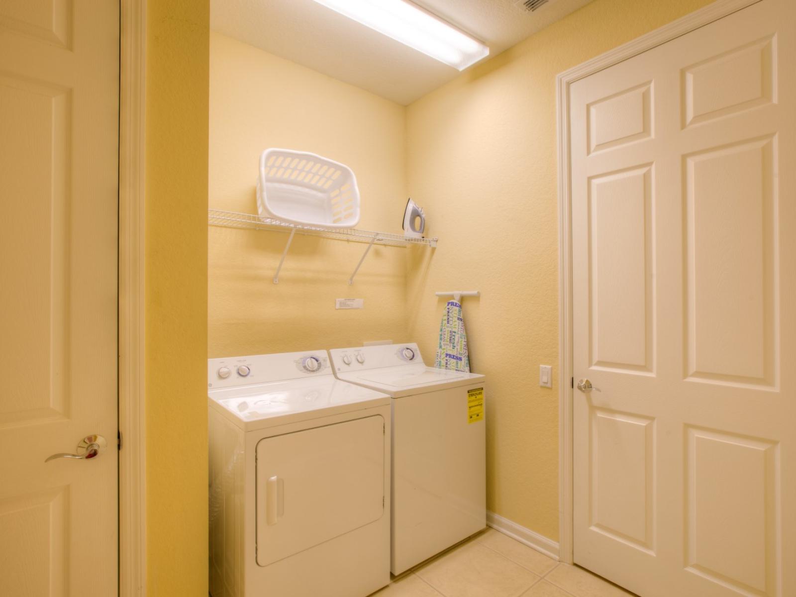 The laundry area boasts a full-size washer and dryer, ensuring that you can easily keep your clothes fresh and clean throughout your stay.