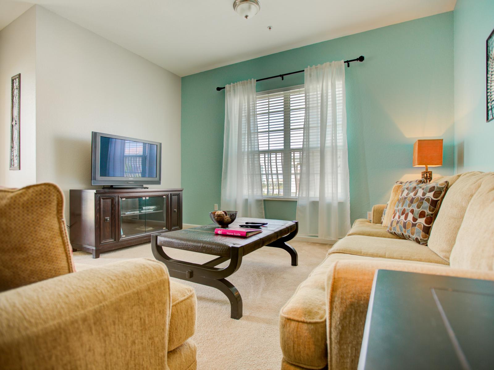 Entertainment meets comfort: our living area is your haven for leisure and relaxation.