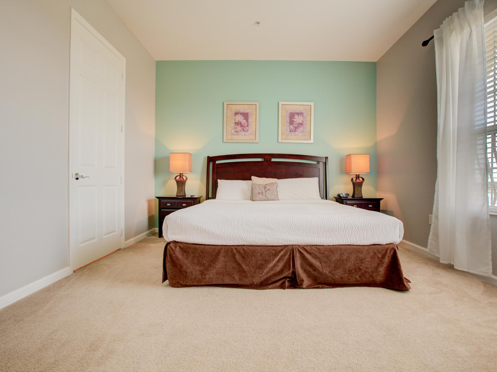 - Opulent bedroom of the condo in Orlando - Lavish details and tranquil ambiance create a haven of relaxation. - A relaxing double bed provided for restful night sleep - Beautiful table lamps enhancing the beauty of the room