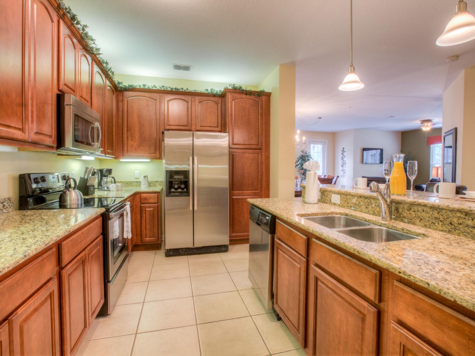 Magnificent kitchen of the condo in Orlando - Marvelous wooden work throughout the kitchen area - Expose your inner chef in our fully equipped kitchen - Stainless steel appliances and all kitchen accessories available