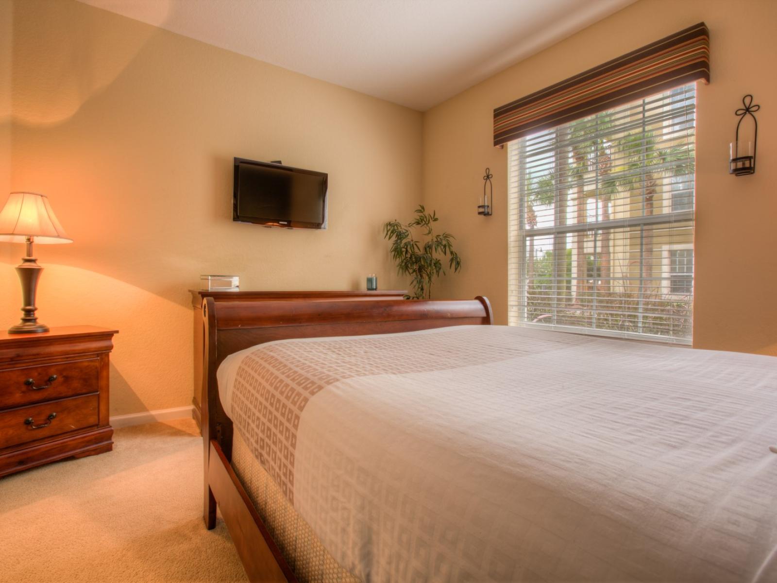 Bringing the essence of nature indoors with a serene bedroom featuring a rustic wooden bed and cozy table lamp.