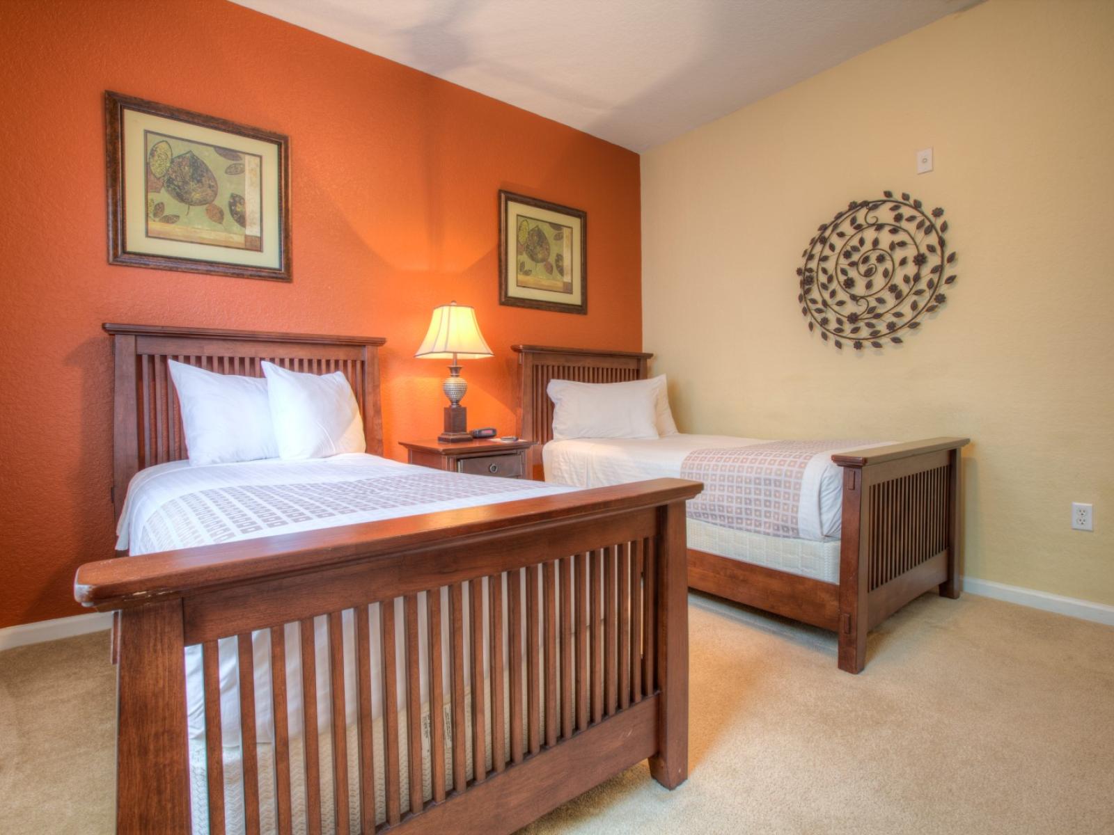 Inviting bedroom of the condo in Orlando - Imaginative design converge to create the space  a haven for restful sleep - stunningly painted wall with aesthetic wall paintings - Boasting two cozy single beds - Neat and fresh linen - Carpeted floor