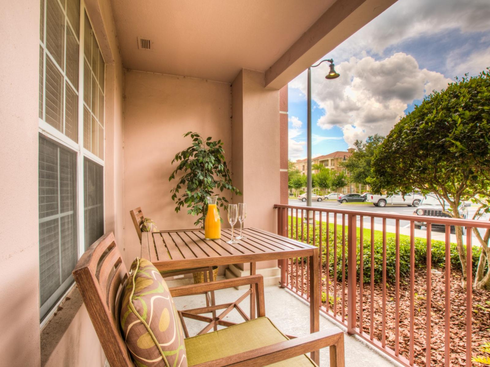 Al fresco perfection: a charming outdoor escape with a cozy table and chair setup. Embrace the beauty of nature while savoring delightful moments in this inviting outdoor haven.