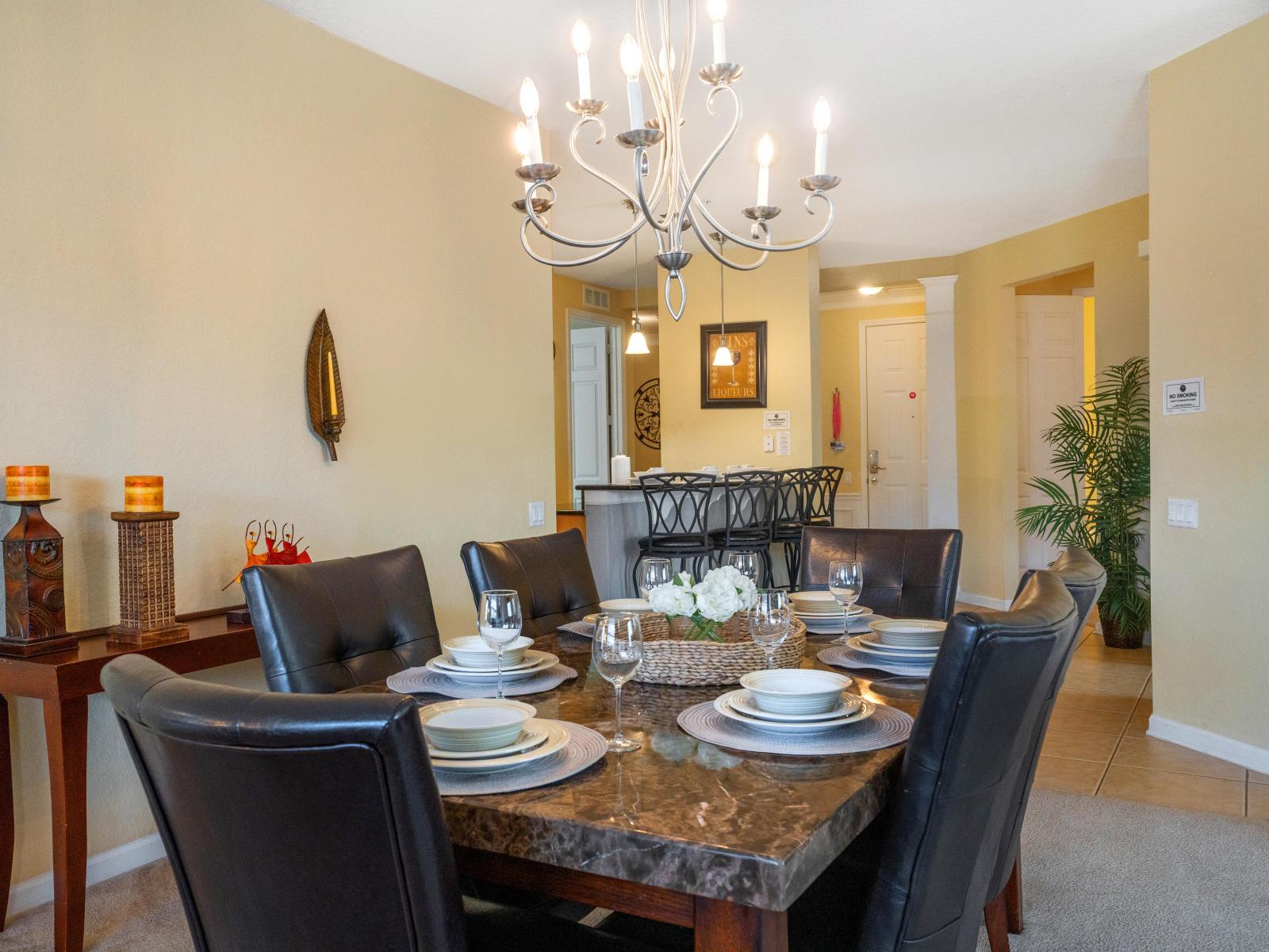 The dining area, spacious enough to accommodate six, sets the stage for elegant gatherings and cherished moments shared over delectable meals. A setting where laughter flows as freely as the conversation, creating memories to treasure.