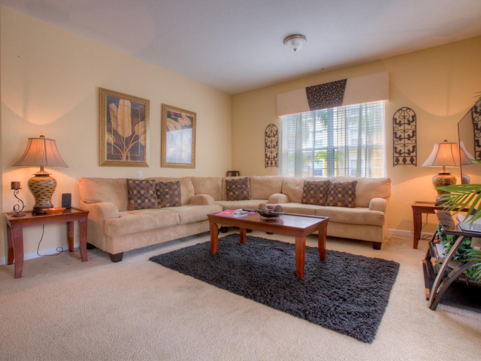 Spectacular Living area of the condo in Orlando - Unwind in the comfort of our townhouse living area with cozy sofas - Stunningly organized space for relaxation - Majestic decor with wall paintings - Availability of TV and Netflix