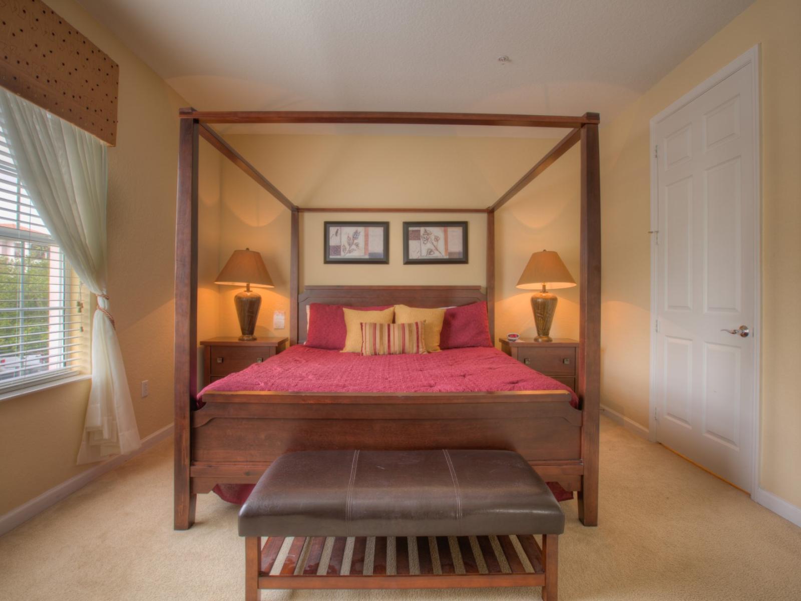 Spacious bedroom of the condo in Orlando - Comfortable double bed -  Stunningly carpeted floor - Majestic table lamps - Gloriously designed bedside window with mesmerizing outside views - Cozy and refreshing ambiance