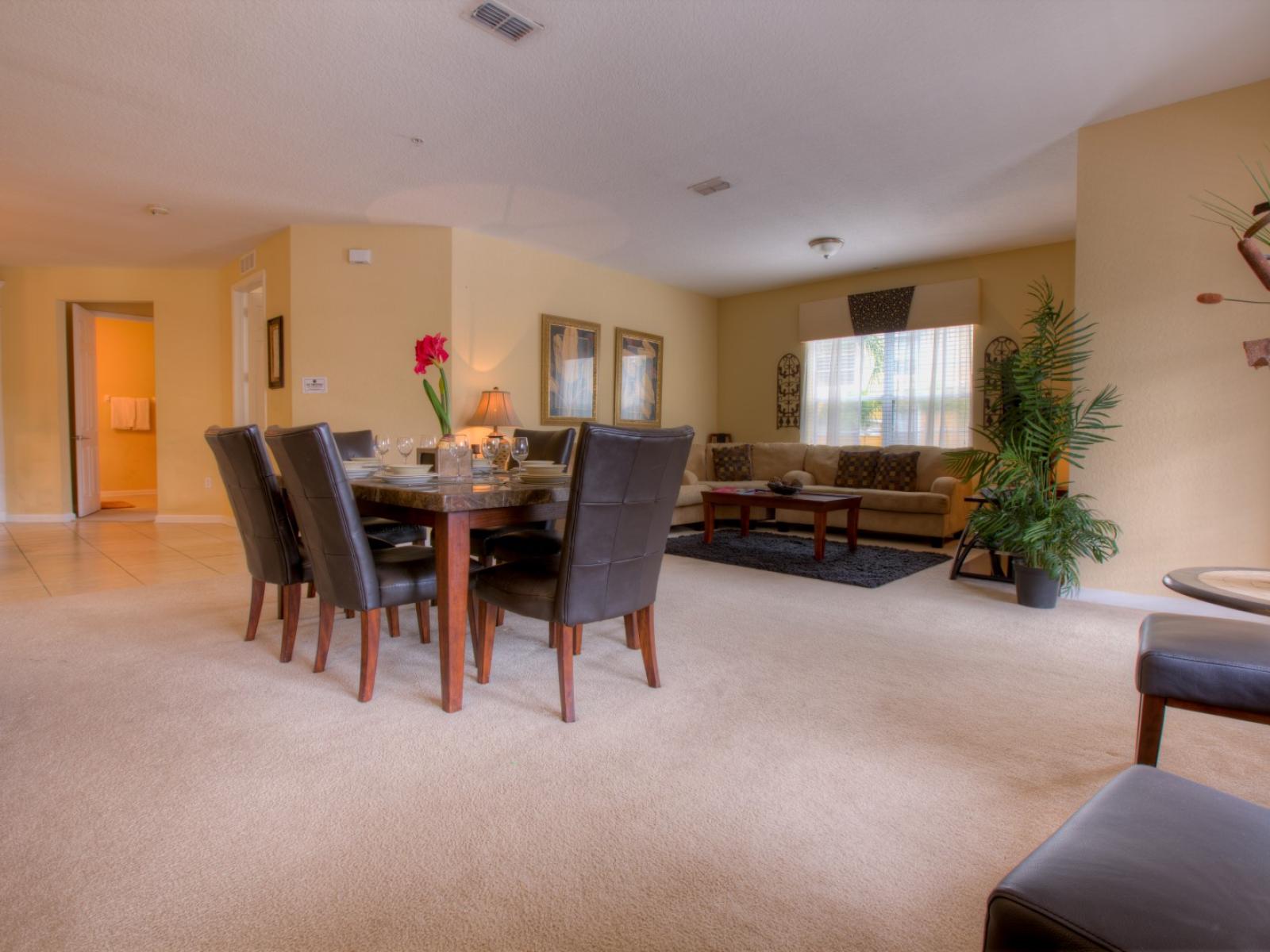 Elevate your dining and living experience in our spacious area of the condo in Orlando  - Every meal becomes a celebration, and every moment a cherished memory. - Cozy sofas and fabulous 6 persons dinning