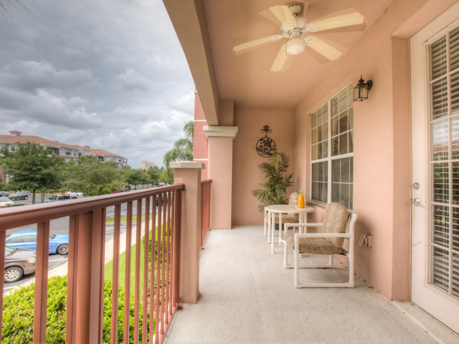 The balcony with chairs at Vista Cay Resort offers a serene escape, inviting guests to relax and soak in breathtaking vistas while enjoying the gentle embrace of the outdoors.