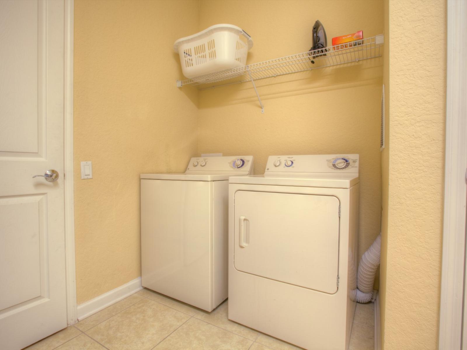 Convenient laundry area of the condo in Orlando - Boasts a full washer and dryer setup - Providing guests with the ultimate convenience to refresh their wardrobe and maintain their vacation rhythm effortlessly.