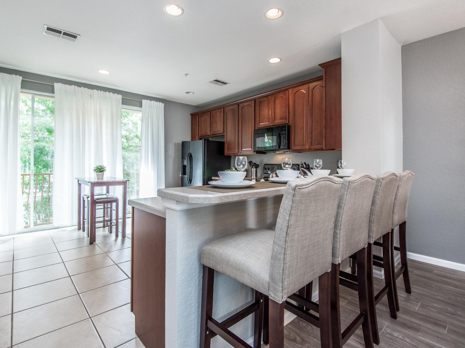 Culinary Haven: Embrace the joy of cooking in our kitchen with a convenient countertop table, a culinary haven for your stay