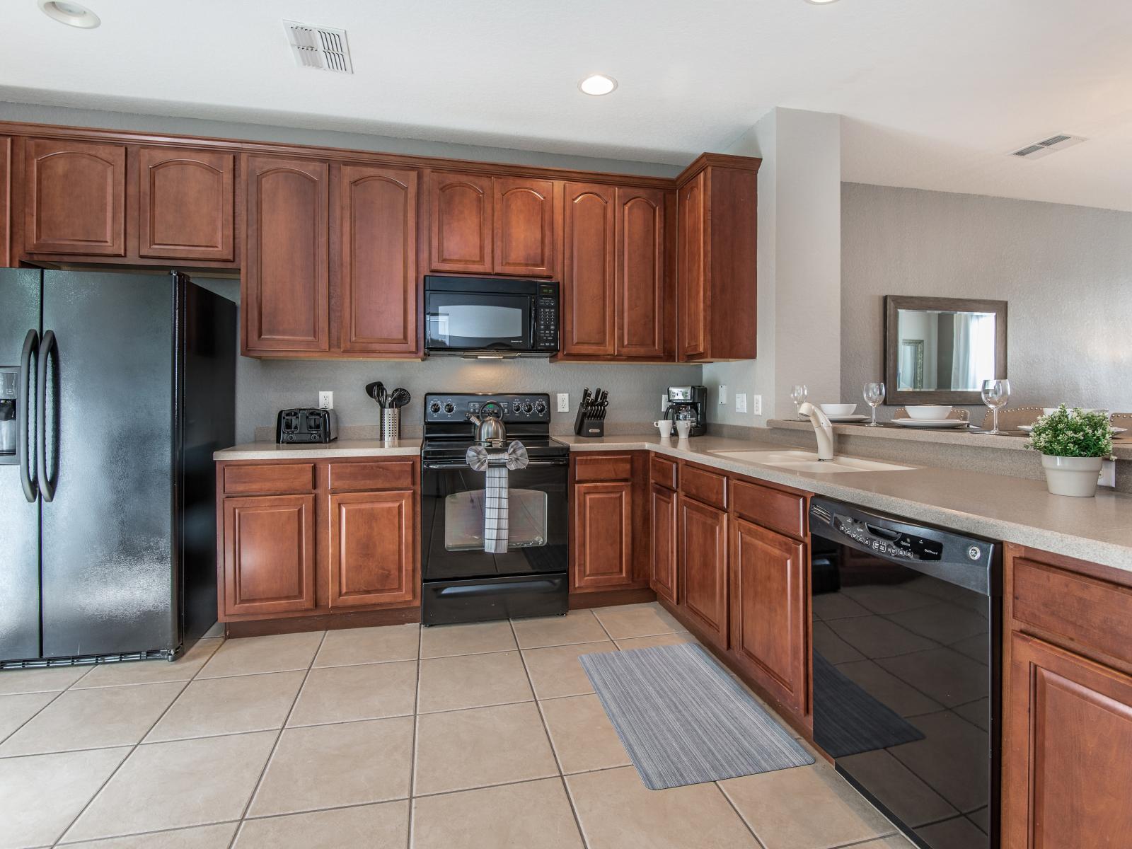 Step into the heart of the home, where an open concept kitchen awaits, fully furnished and featuring a sleek countertop table that beckons for casual meals, quick snacks, or lively conversations.