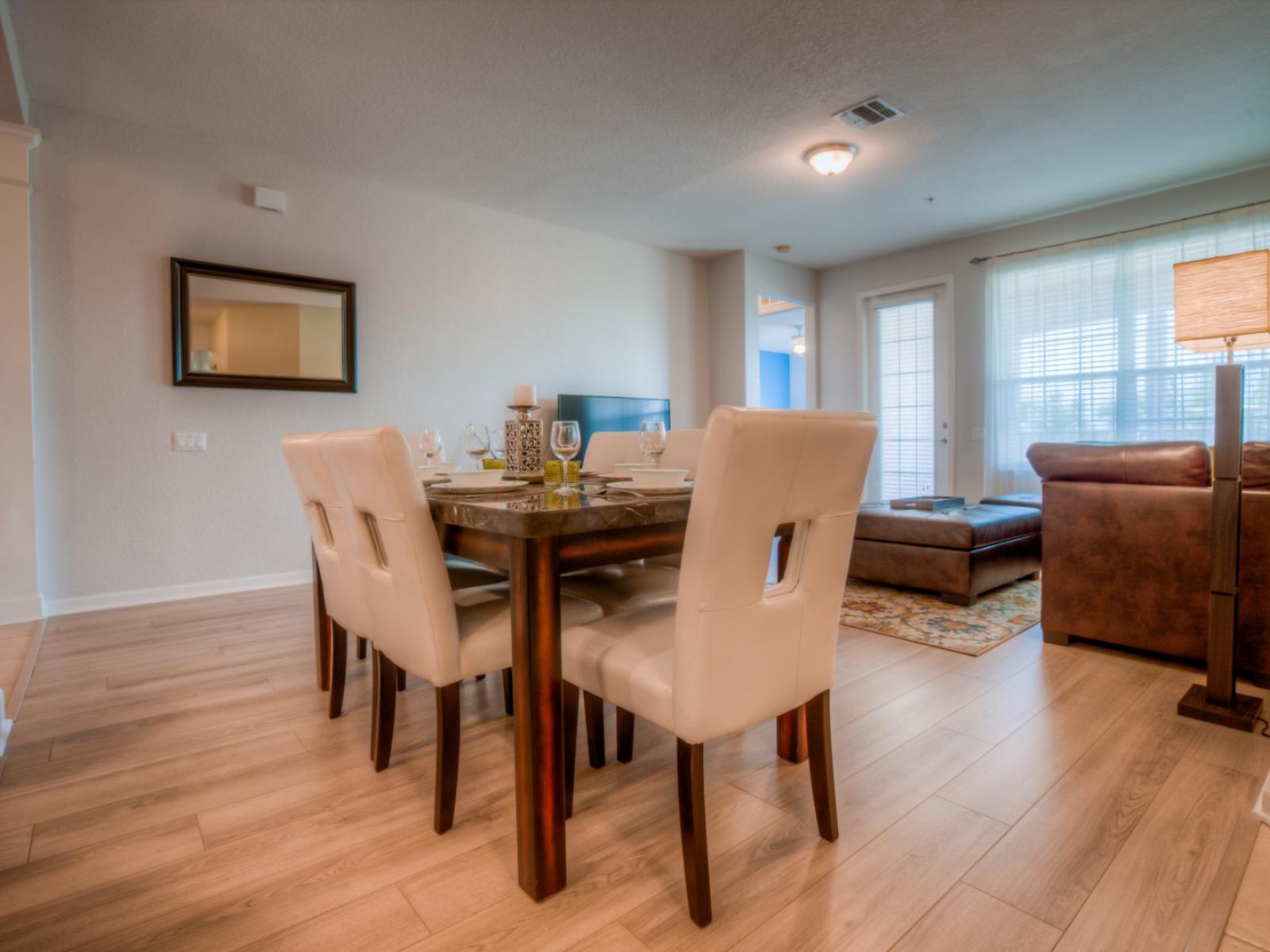 Indulge in comfort and style in our dining area of the condo in Orlando - Welcomes you with cozy and plush 6 persons dinning table - Ensuring that every meal is a delightful experience with your loved ones.