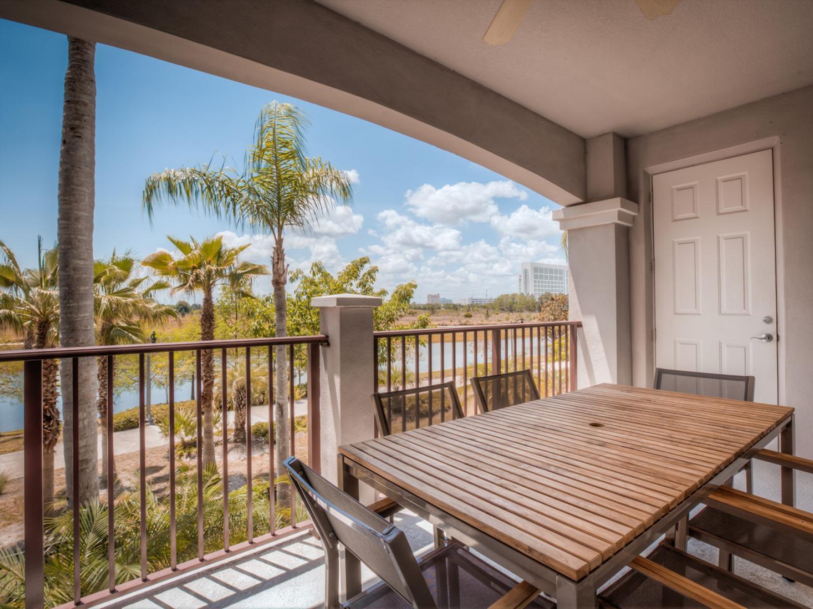 Experience the joy of open-air dining in our inviting private balcony of the condo in Orlando - Every your meals ensures a memorable celebration amidst the fresh outdoor breeze. - Enjoy beautiful lake views while relaxing in our refreshing balcony