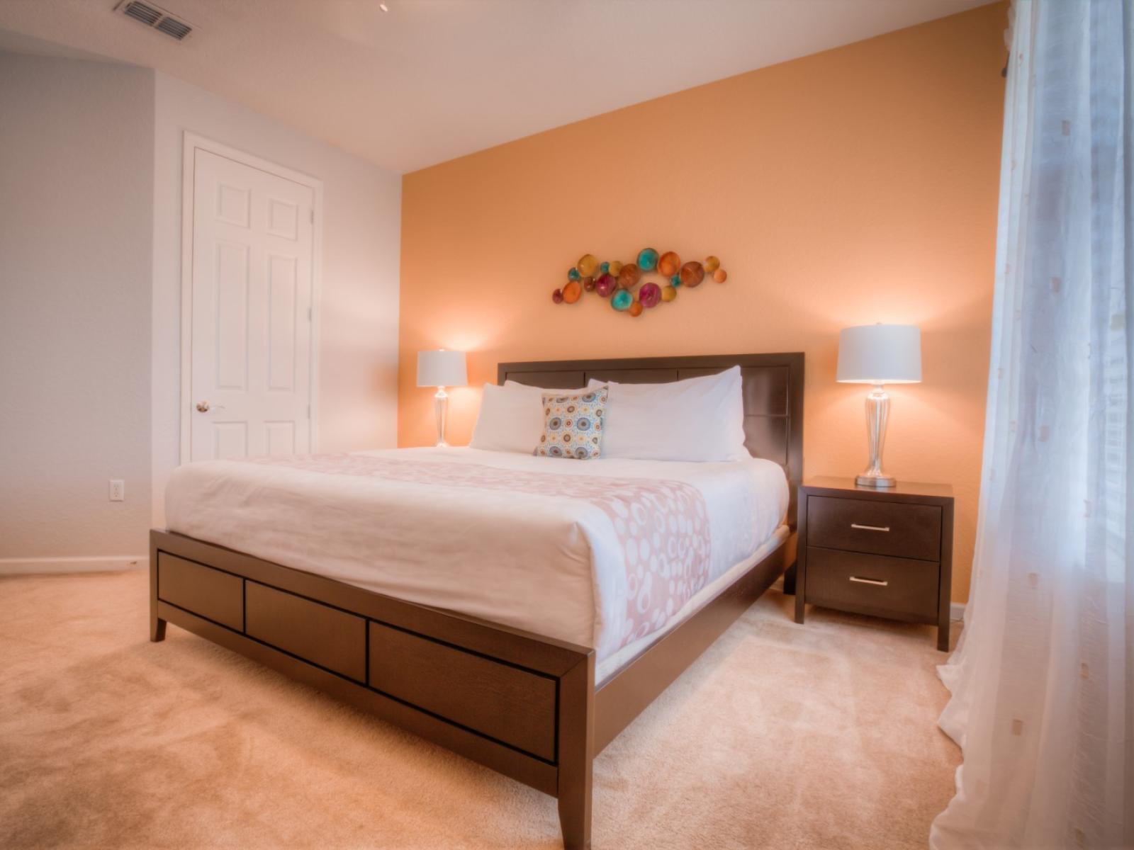 Step into the tranquility of this lovely bedroom of the condo in Orlando - Offering a cozy retreat with double bed for a restful night's sleep - Marvelously painted walls and carpeted floor - Beautiful table lamps enhancing the decor