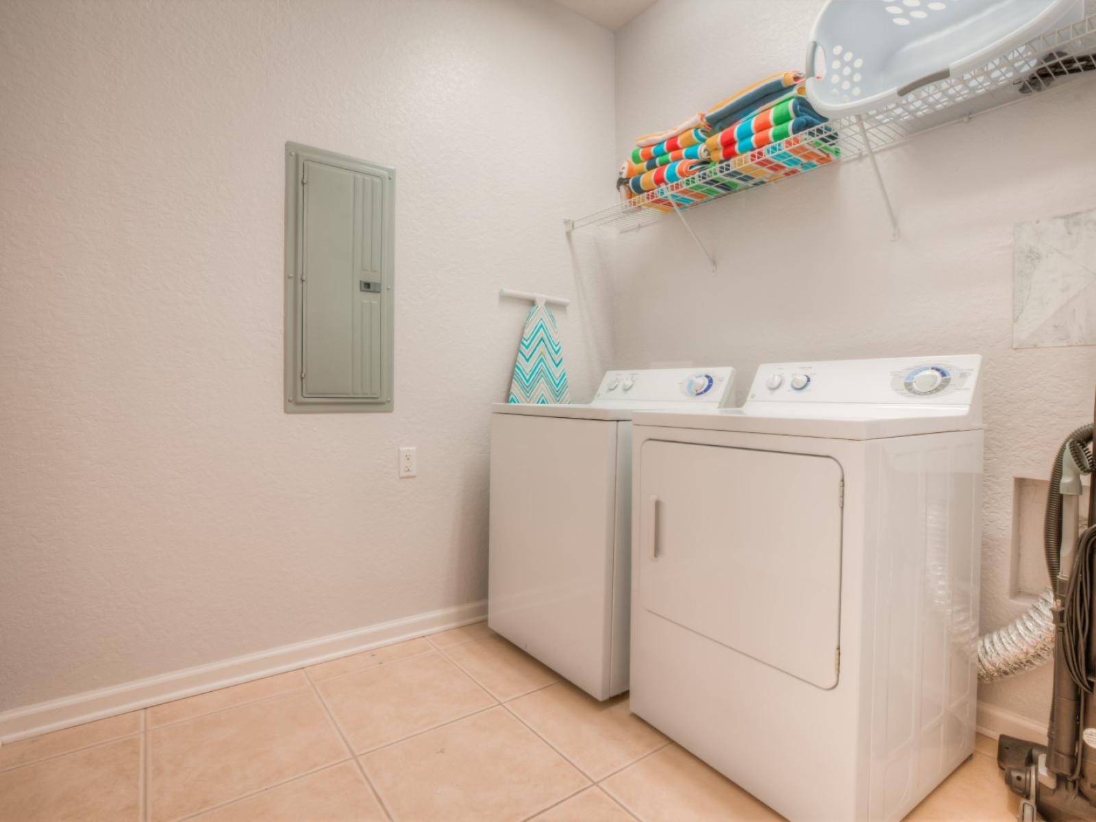 Convenient laundry area of the condo in Orlando - Boasts a full washer and dryer setup - Providing guests with the ultimate convenience to refresh their wardrobe and maintain their vacation rhythm effortlessly.