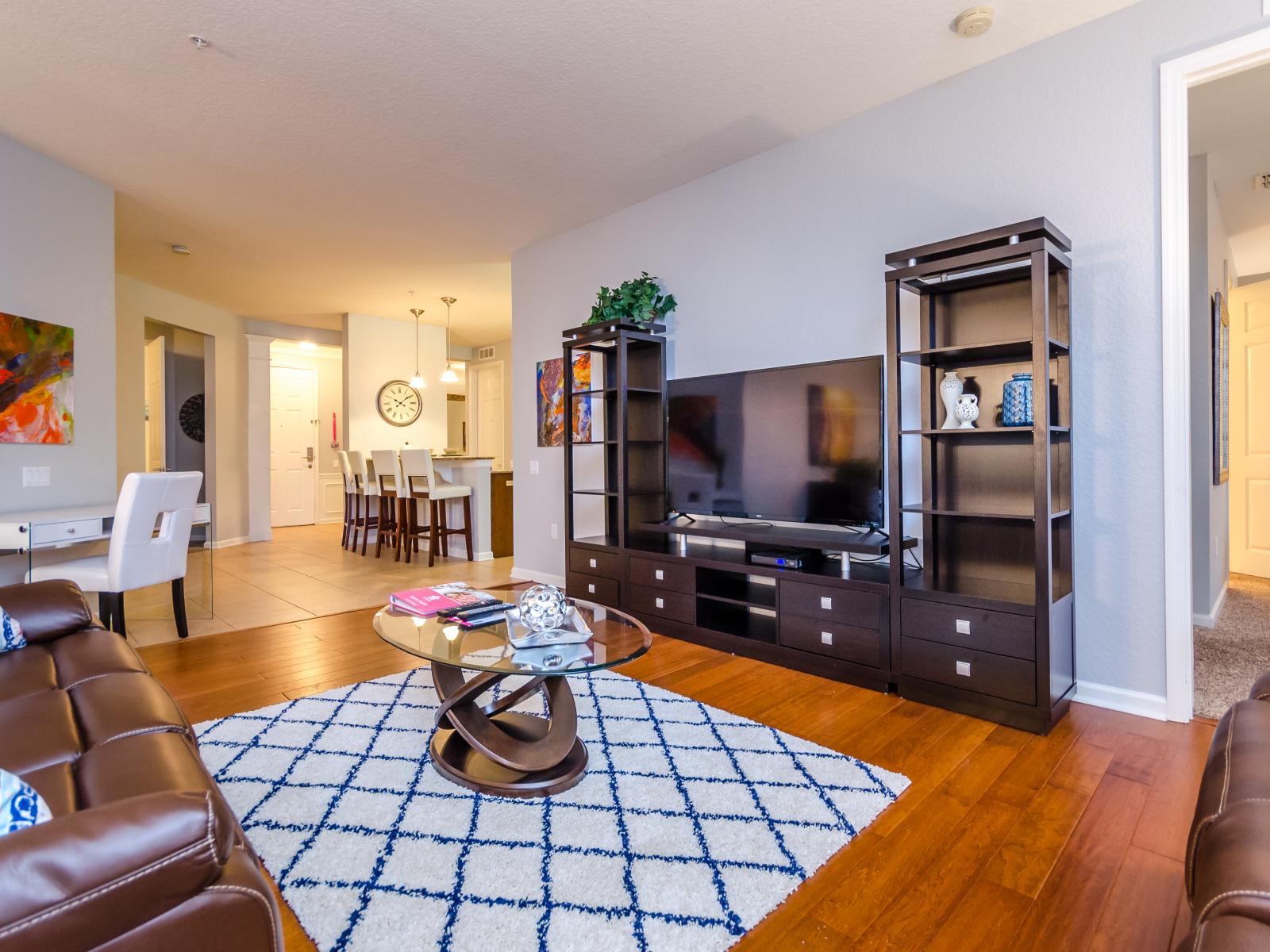 The main living area - boasting inviting chairs and a Smart TV – where every moment is an invitation to unwind, indulge, and enjoy entertainment in the lap of comfort. Embrace the essence of leisure and luxury.