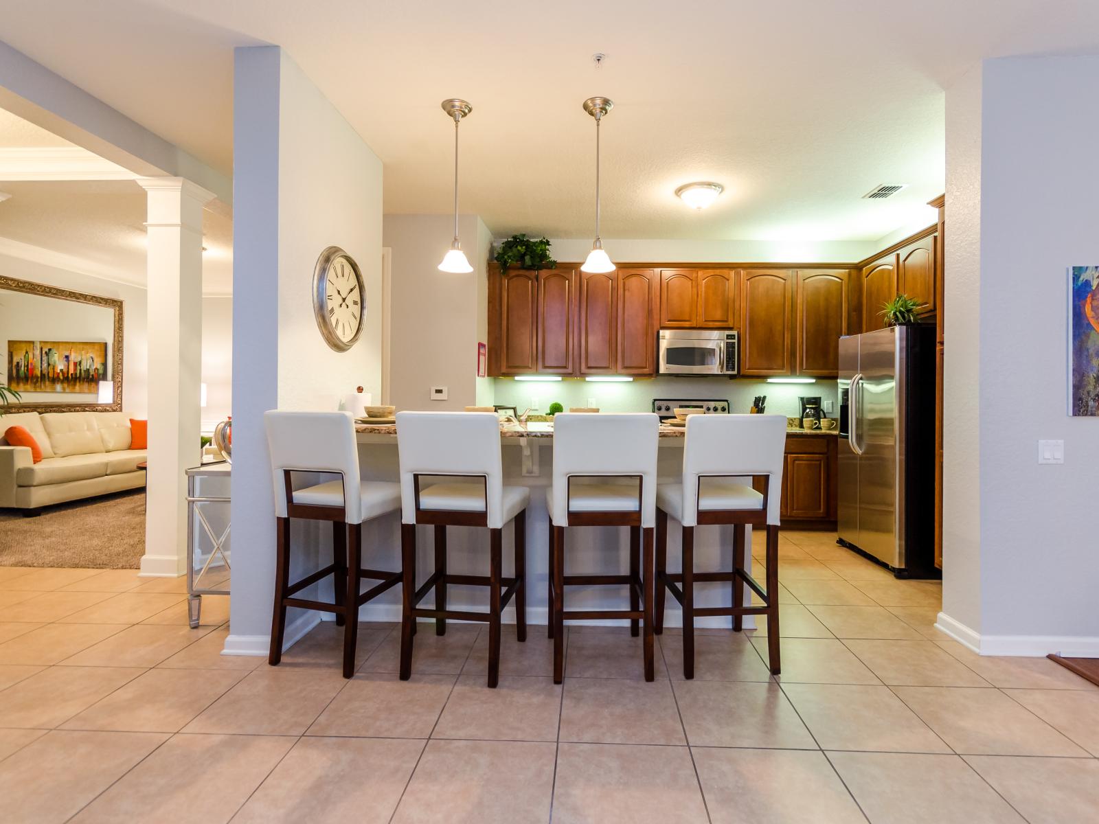 The stylish kitchen table top and high chairs – where every meal becomes a delightful affair, surrounded by elegance and comfort. Embrace the joy of shared moments and delectable cuisine.