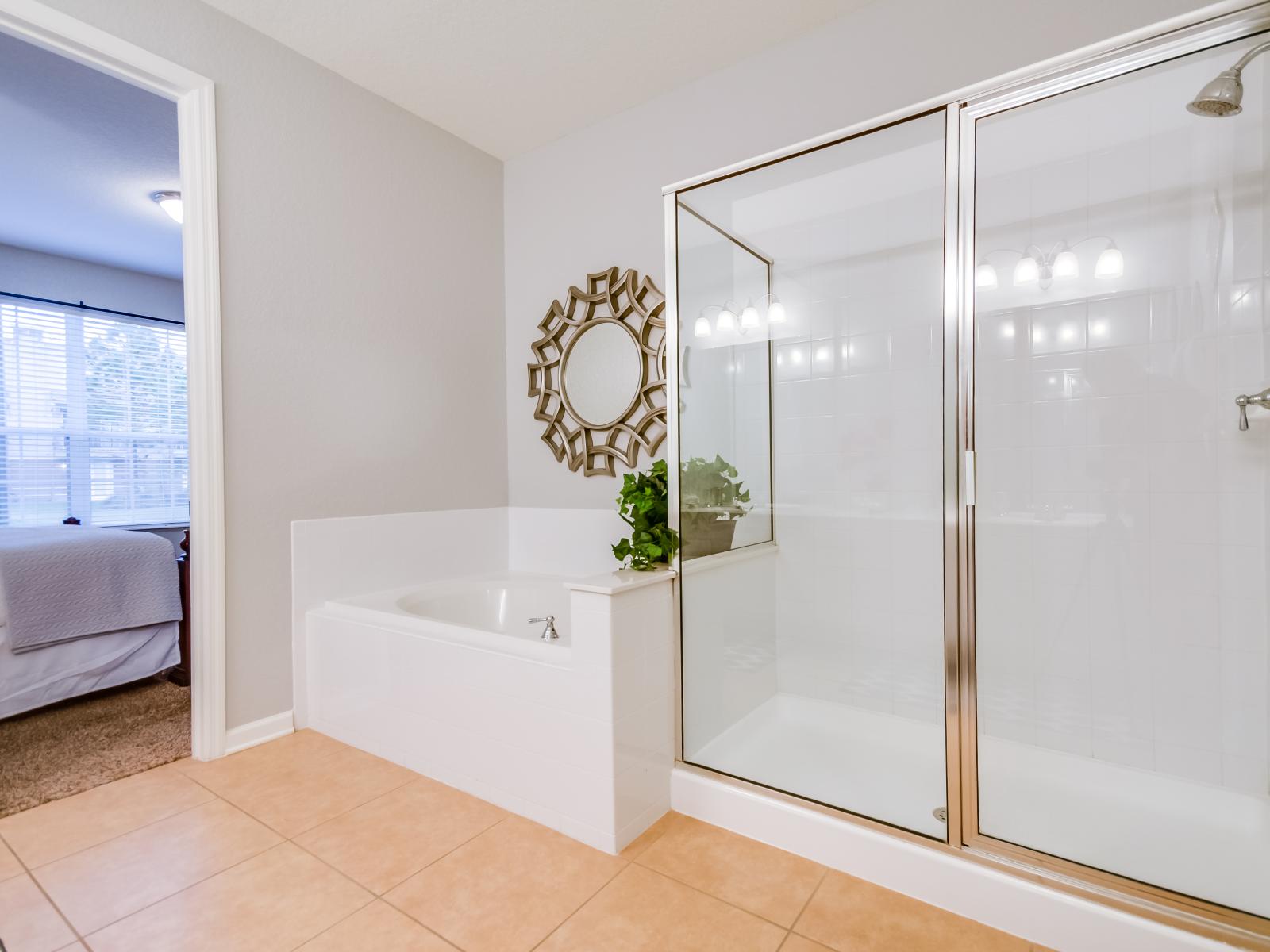 "Relaxing Retreat: Unwind in the luxurious bathtub of this beautifully appointed bathroom, offering the perfect space for a soothing soak.