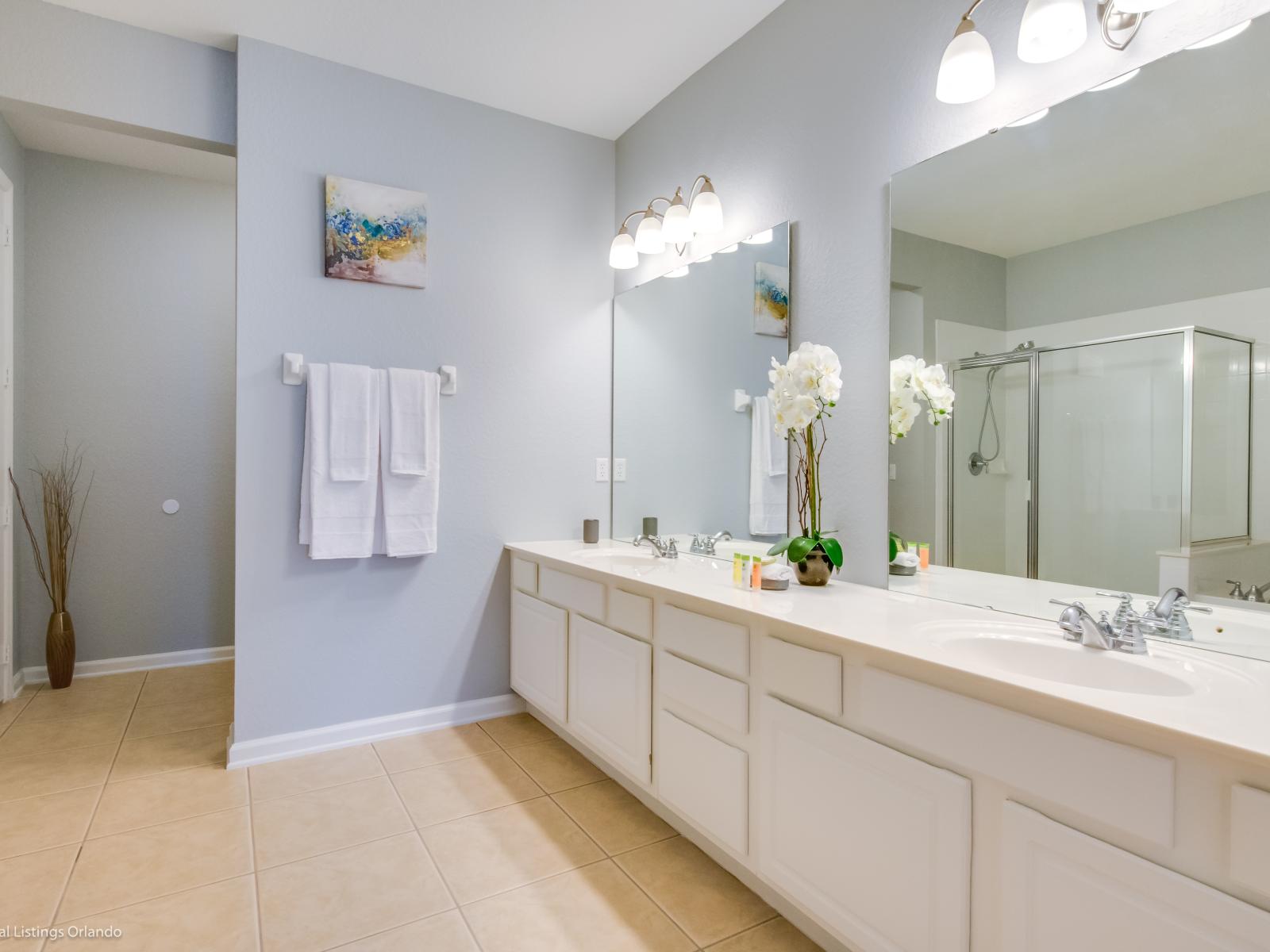 Elevated Shower Experience: Step into our bathroom with a walk-in shower, offering a perfect blend of style and convenience for a refreshing getaway