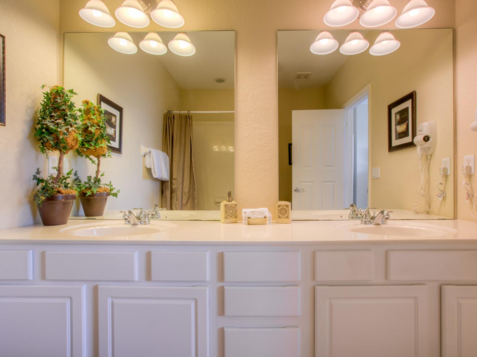 Enjoy a good hot bath in this clean and spotless bathroom with walk-in shower.