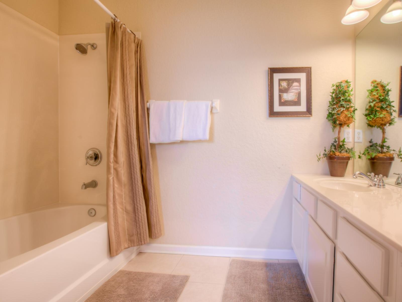 What could be better than a warm, comforting shower in this neat and clean bathroom.