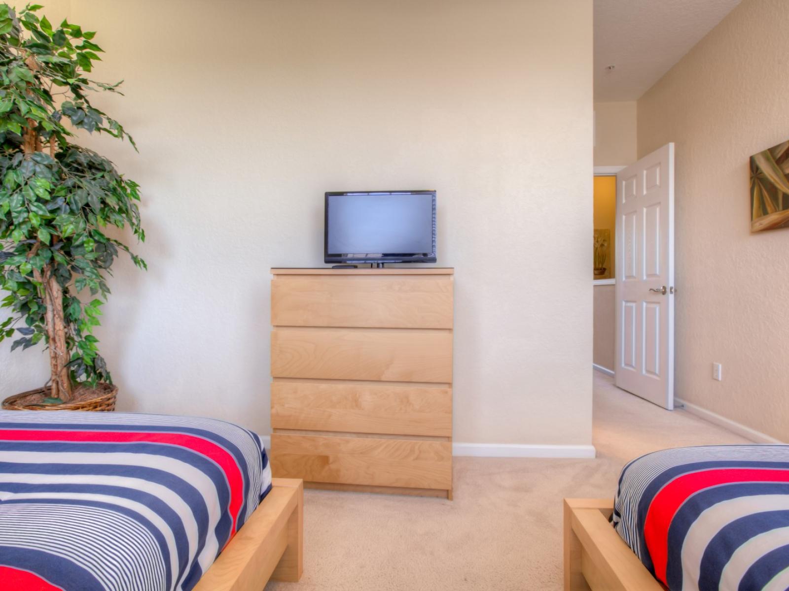 Plush bedroom of the townhouse in Orlando Florida - Featuring two plush double bed - Well-appointed bedroom with neutral tones for a calming atmosphere - Tranquil bedroom retreat for restful nights