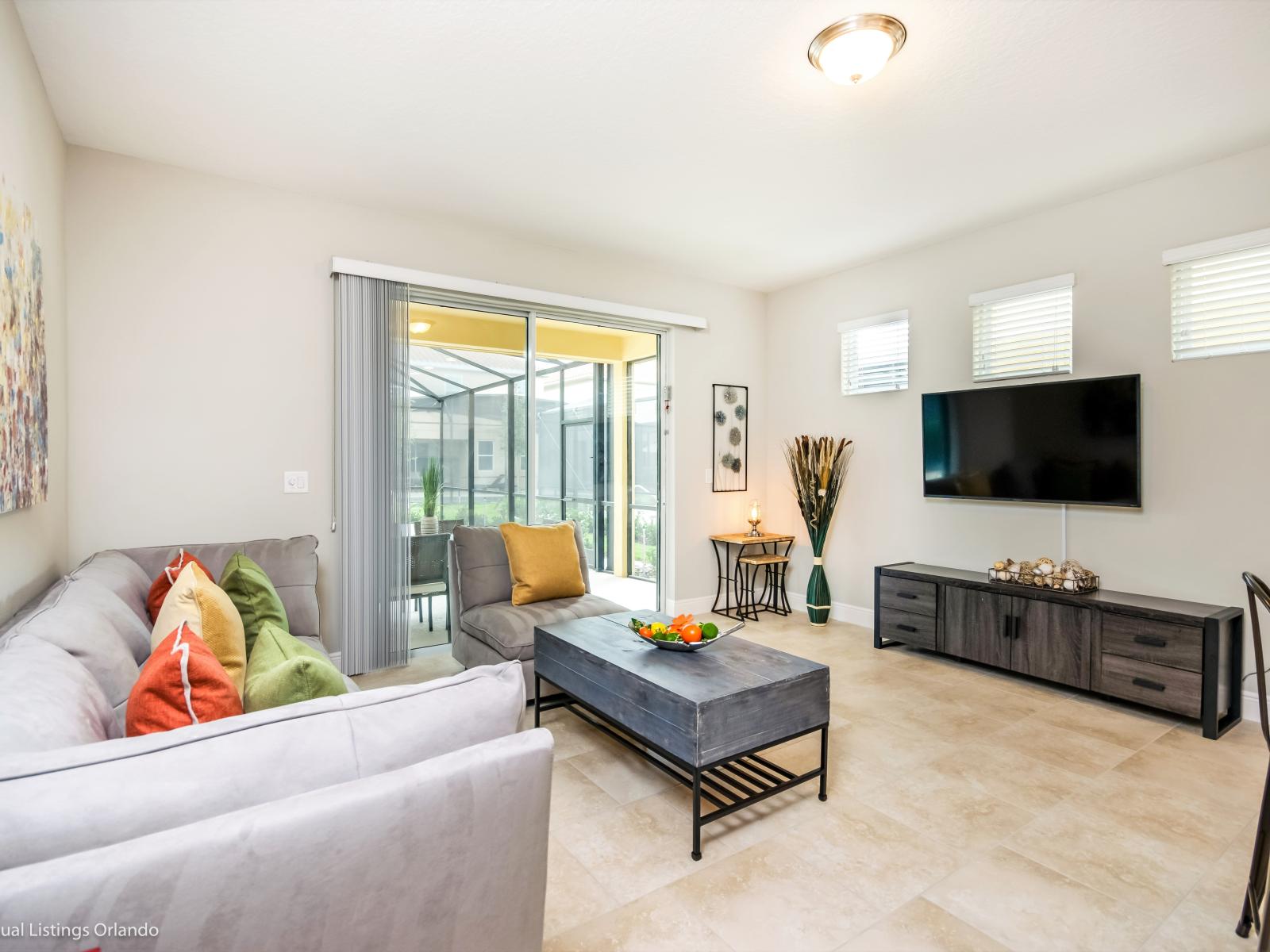 Serene living area of the home in Davenport Florida - Unwind in grandeur and comfort - Living area beckons with plush sofas  - Smart TV and Netflix - A place where relaxation knows no bounds