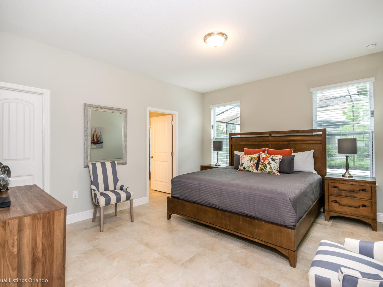 Cozy bedroom of the home in Davenport Florida - Modern bedroom with sleek design and plenty of natural light - Well-appointed bedroom with neutral tones for a calming atmosphere - Smart TV and Netflix