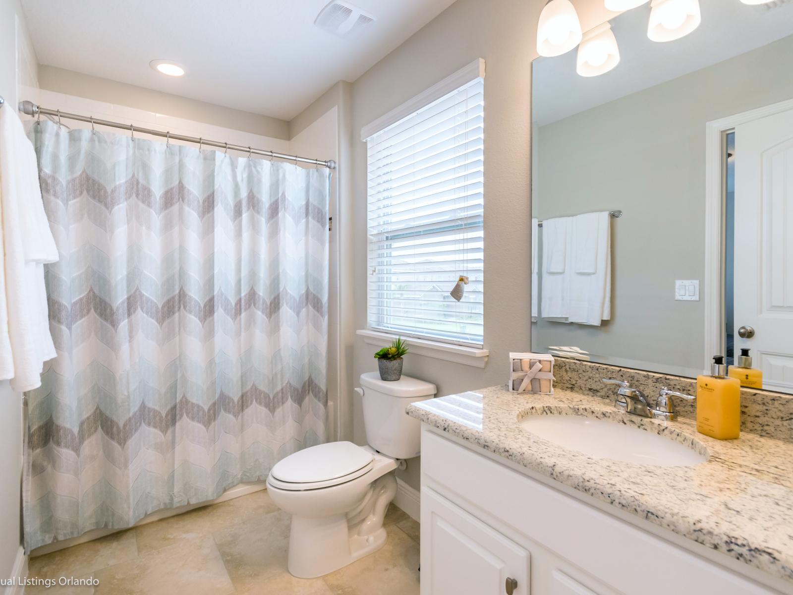 Escape to tranquility in our sleek and stylish bathroom, your personal haven during your stay.