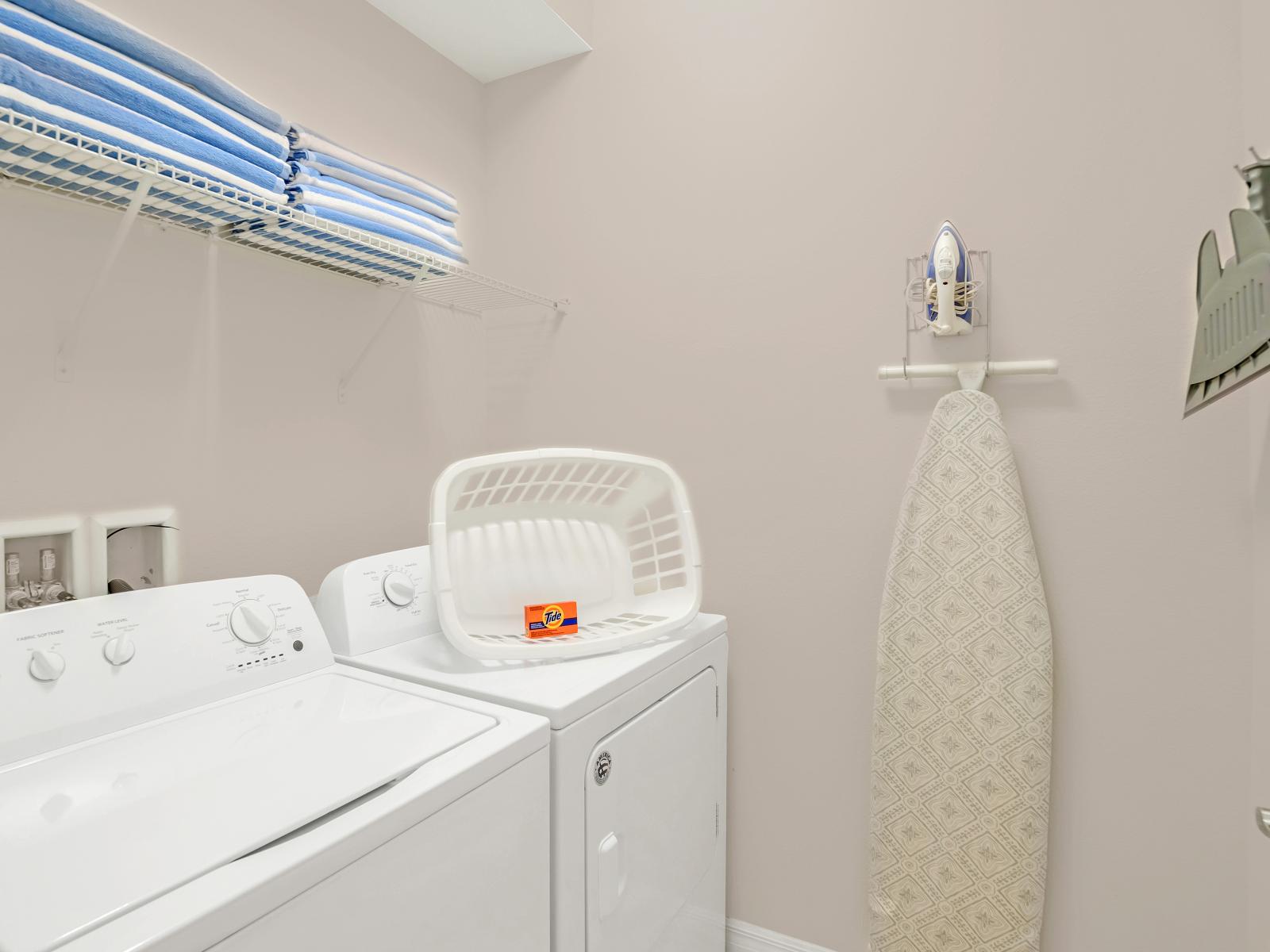 Laundry area of the home in Davenport Florida - Experience the convenience of equipped laundry area - Allowing to refresh your clothes at your own pace