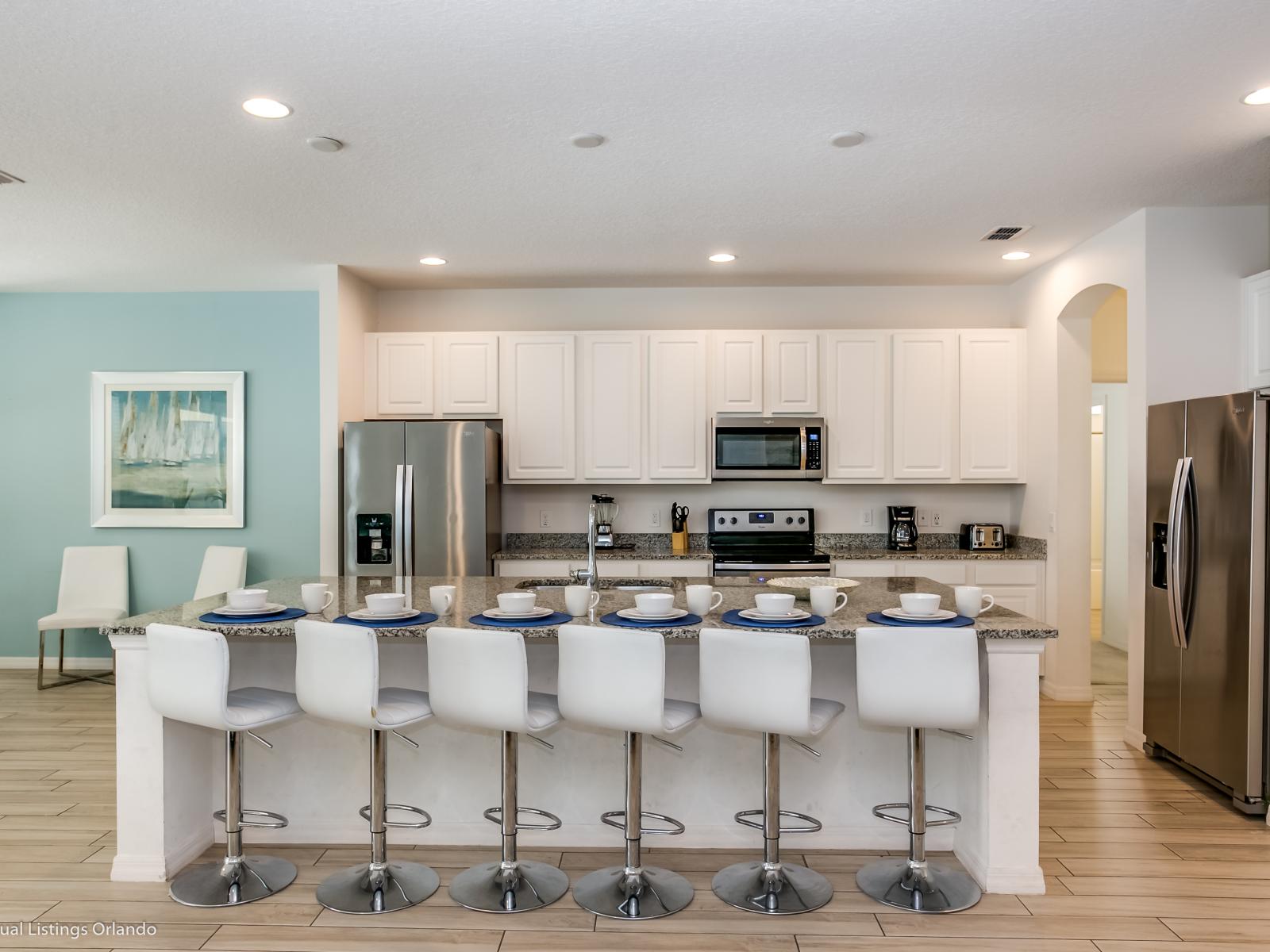 Elegant Kitchen of the Villa in Florida - Fully Equipped - Storage space for organized and clutter-free counters - The fully-equipped kitchen has granite counters, stainless appliances and large pantry