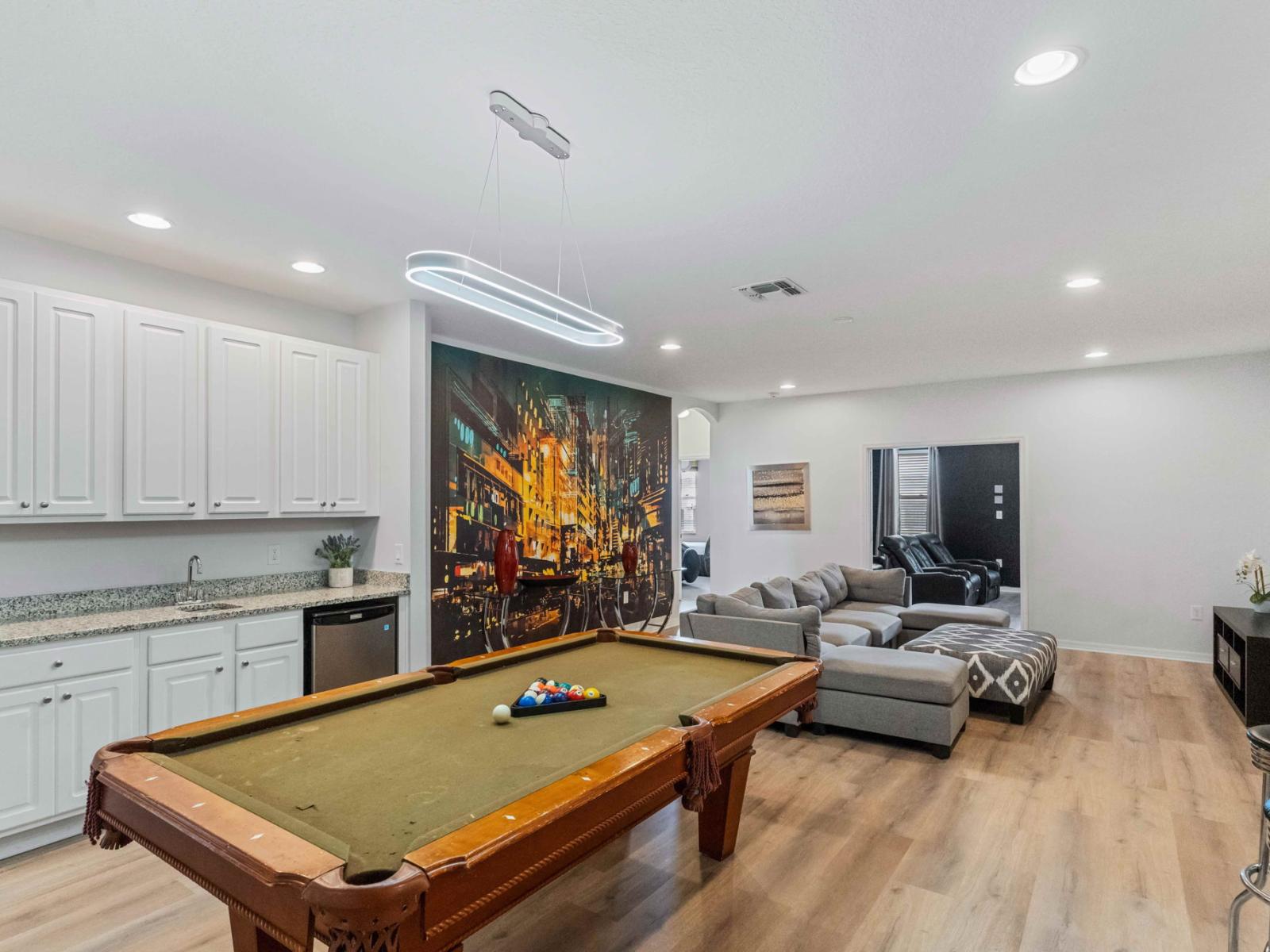 Game nights reach new heights in this stylish loft with a pool table centerpiece.