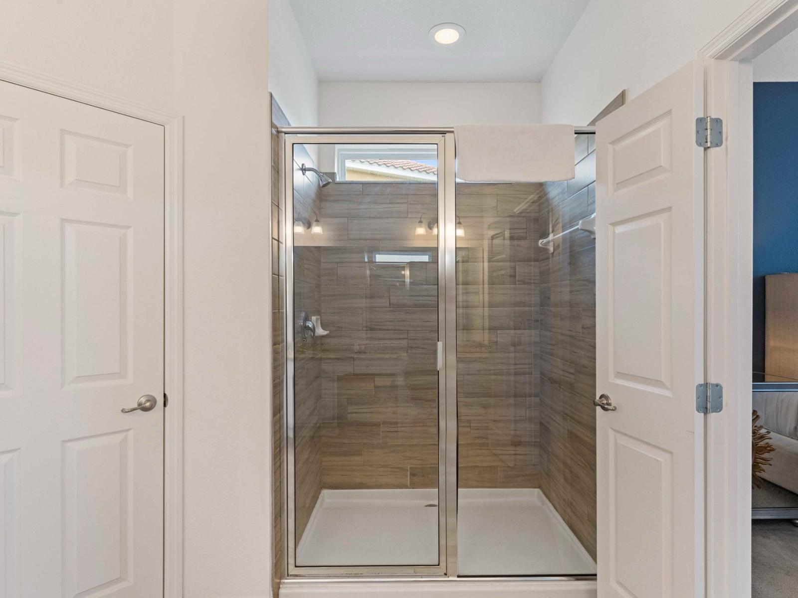 Modern design meets comfort – enjoy a spacious walk-in shower in this stylish bathroom.