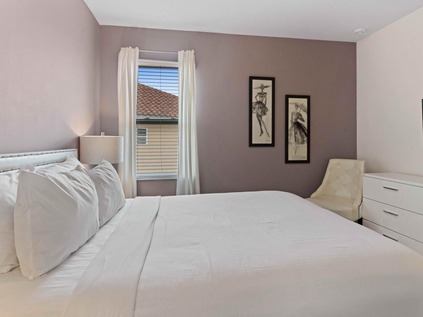 Unwind in comfort and style in Bedroom 8, complete with a plush queen-size bed.