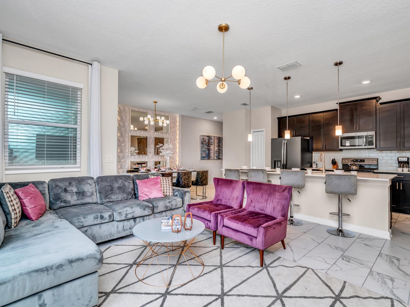 Modern Living Area of the Home in Kissimmee Florida - Comfy Sofas - Stylish furniture arrangement providing comfort and a cohesive look - Smart TV and Netflix - Well-chosen lighting fixtures adding both functionality and charm