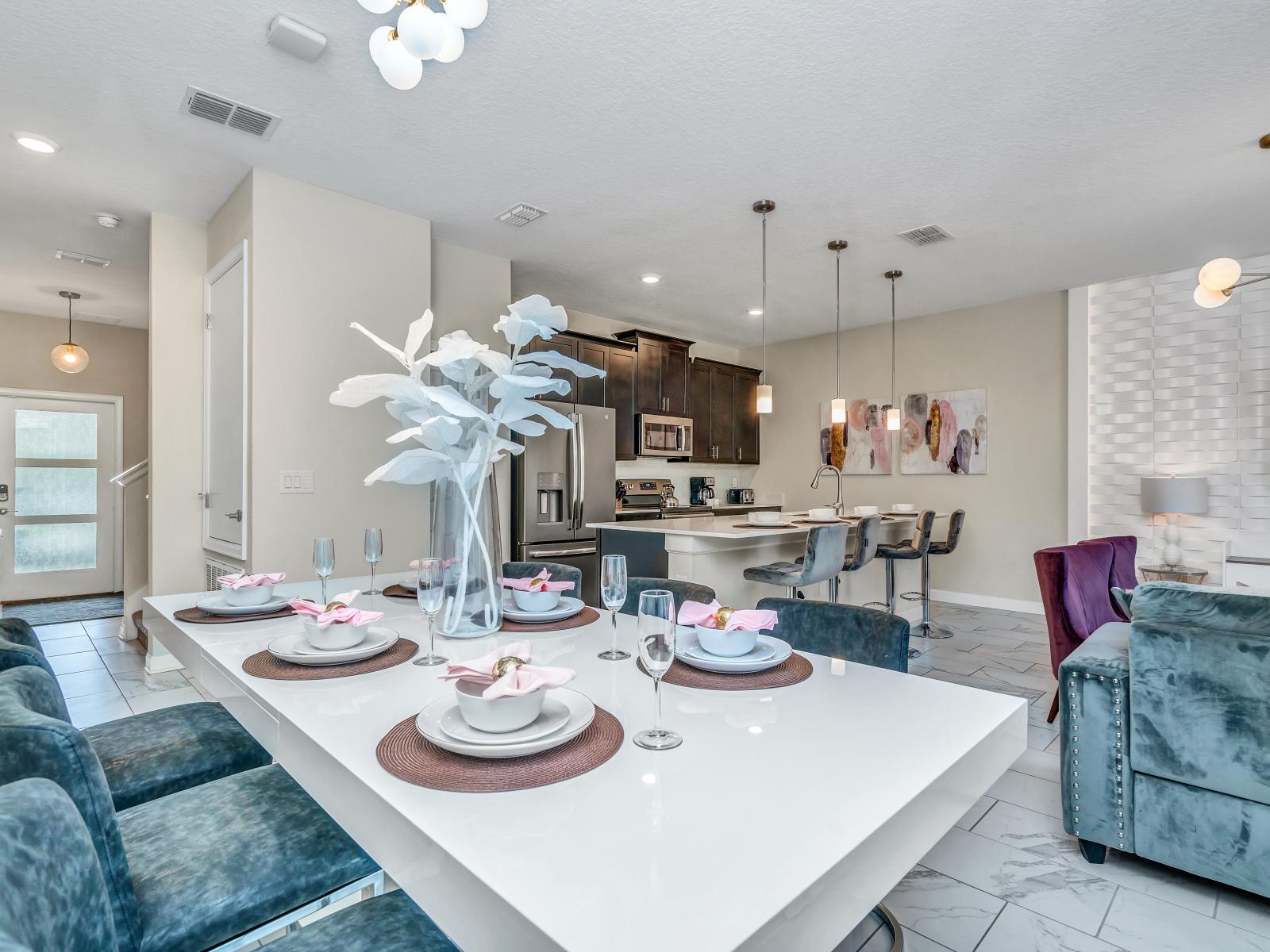 Spacious Townhouse in Kissimmee Florida - Open layout seamlessly connecting the dining area to the kitchen and living area - Luxurious decor for a lavish ambiance - Plush and comfortable seating arrangements