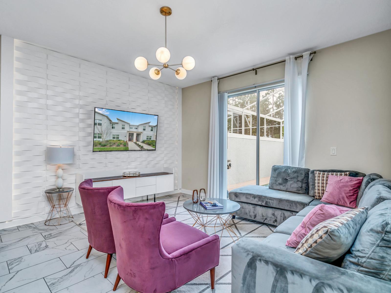 Inviting living Area of the Townhouse in Kissimmee Florida - Features a comfortable couch - Smart TV and Netflix - Elegantly decorated space with a neutral color palette for a timeless appeal