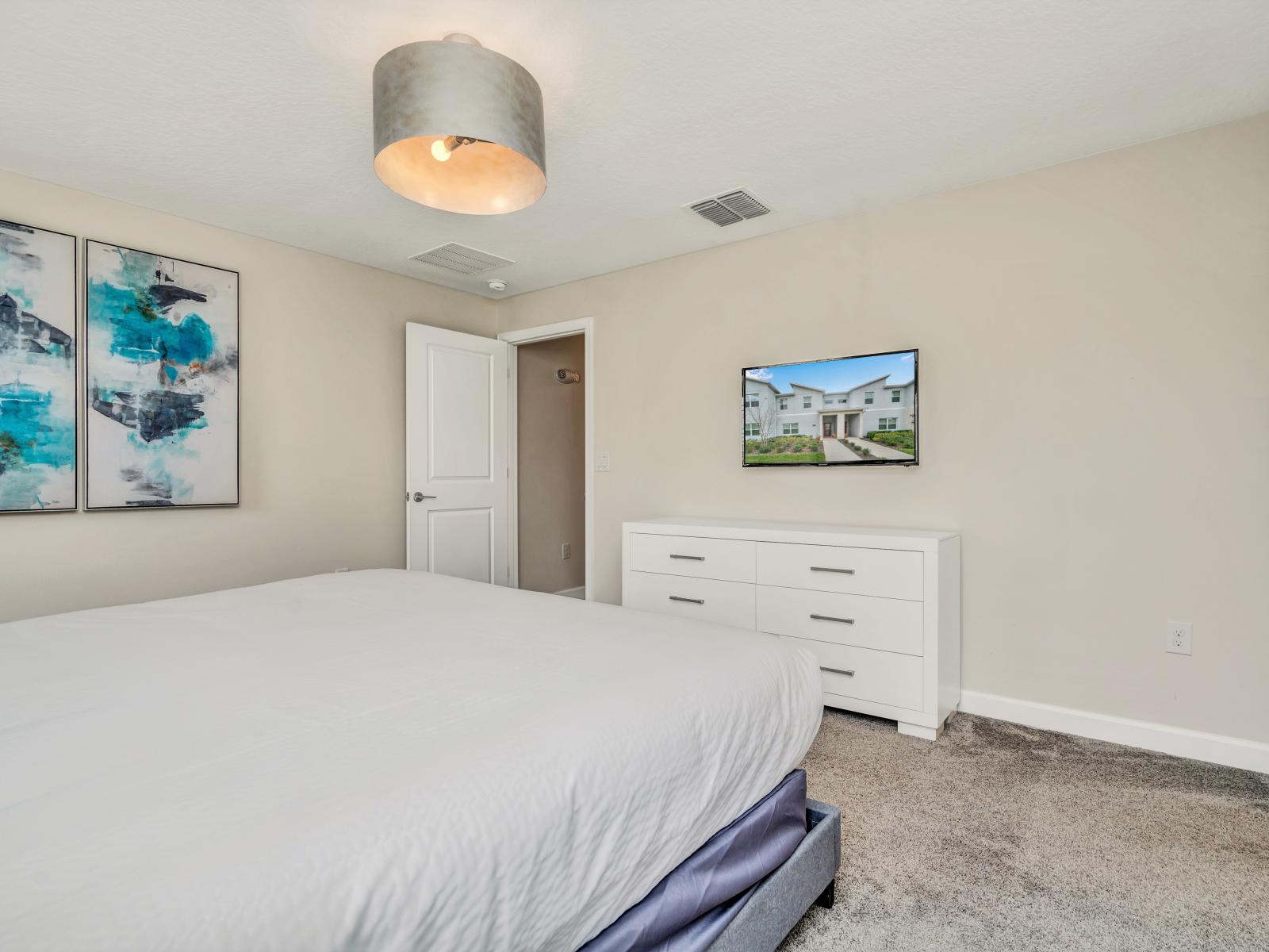 Cozy Bedroom of the Townhouse in Kissimmee Florida - Stylish decor and modern furnishings - Plush bedding and fluffy pillows for a restful sleep - A tranquil ambiance perfect for unwinding and rejuvenating