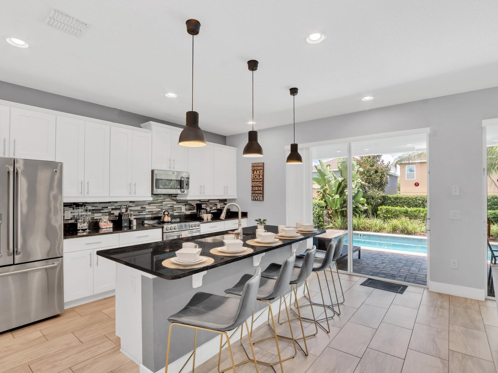 Enchanting Kitchen Area of the Apartment in Kissimmee Florida - Integrated appliances for a seamless and stylish appearance - Functional layout designed for efficient meal preparation - Breakfast Bar for convenience - Ample Natural Light