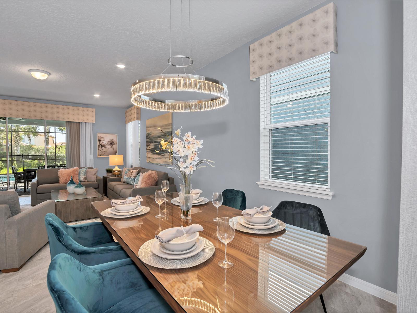 Eclat Dining Area of the Apartment in Davenport Florida - 4 Persons Dining - Statement chandelier or pendant lighting for elegance - Open layout seamlessly connecting the dining area to the kitchen and living room