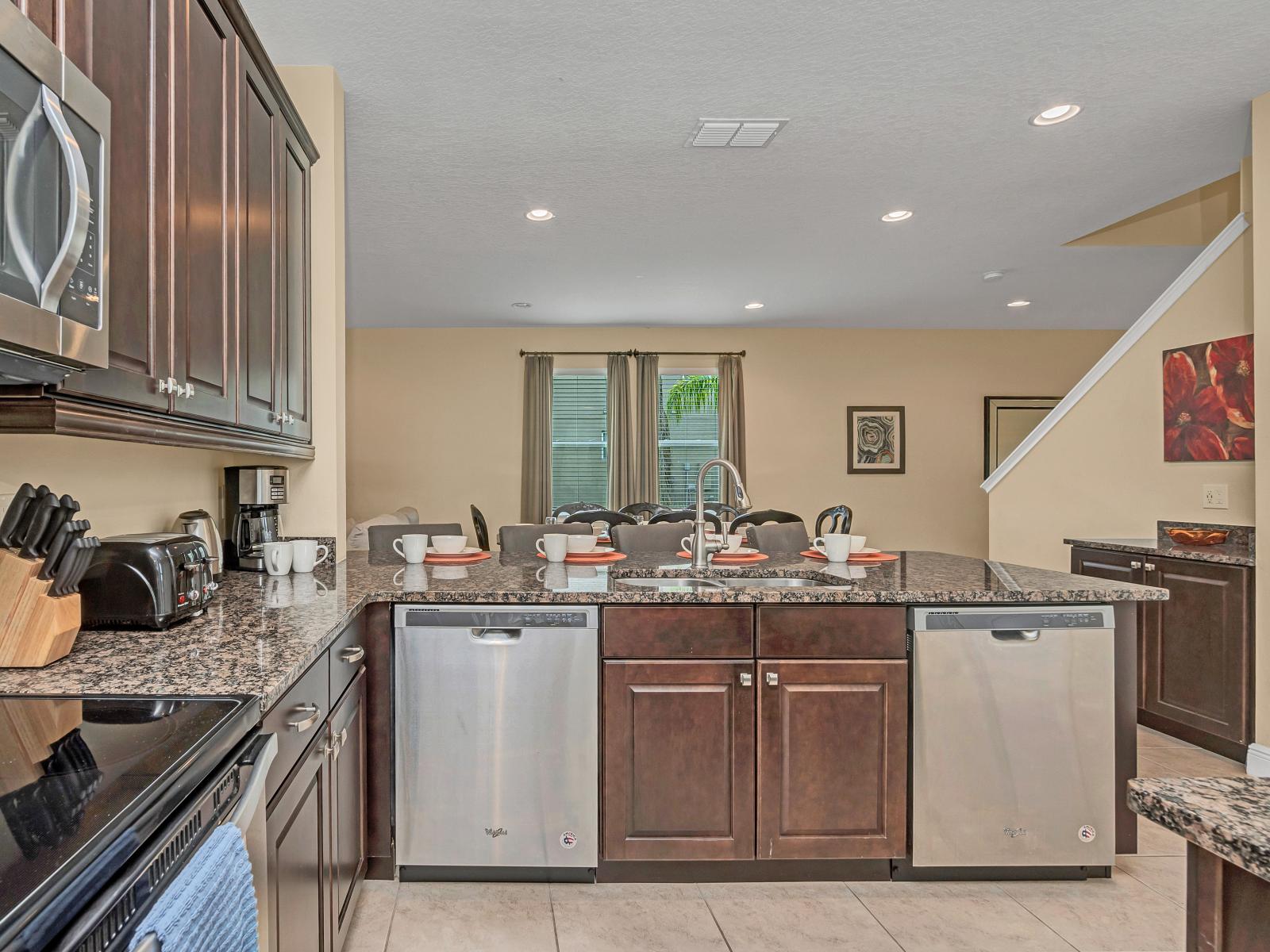 Sleek Kitchen of the Home in Kissimmee Florida - Stainless steel appliances - Functional layout designed for efficient meal preparation - Integrated appliances for a seamless and stylish appearance