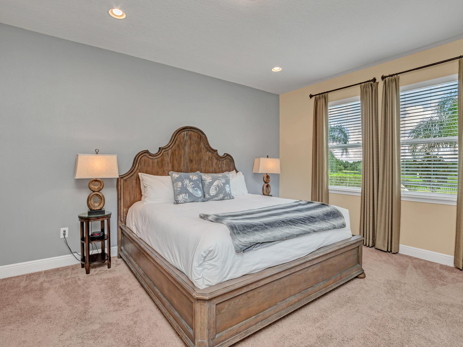 Classic Bedroom of the Home in Kissimmee Florida - Offering cozy double bed - Spacious bedroom offering comfort and style - Minimalist decor, creating a clean and uncluttered sleeping space