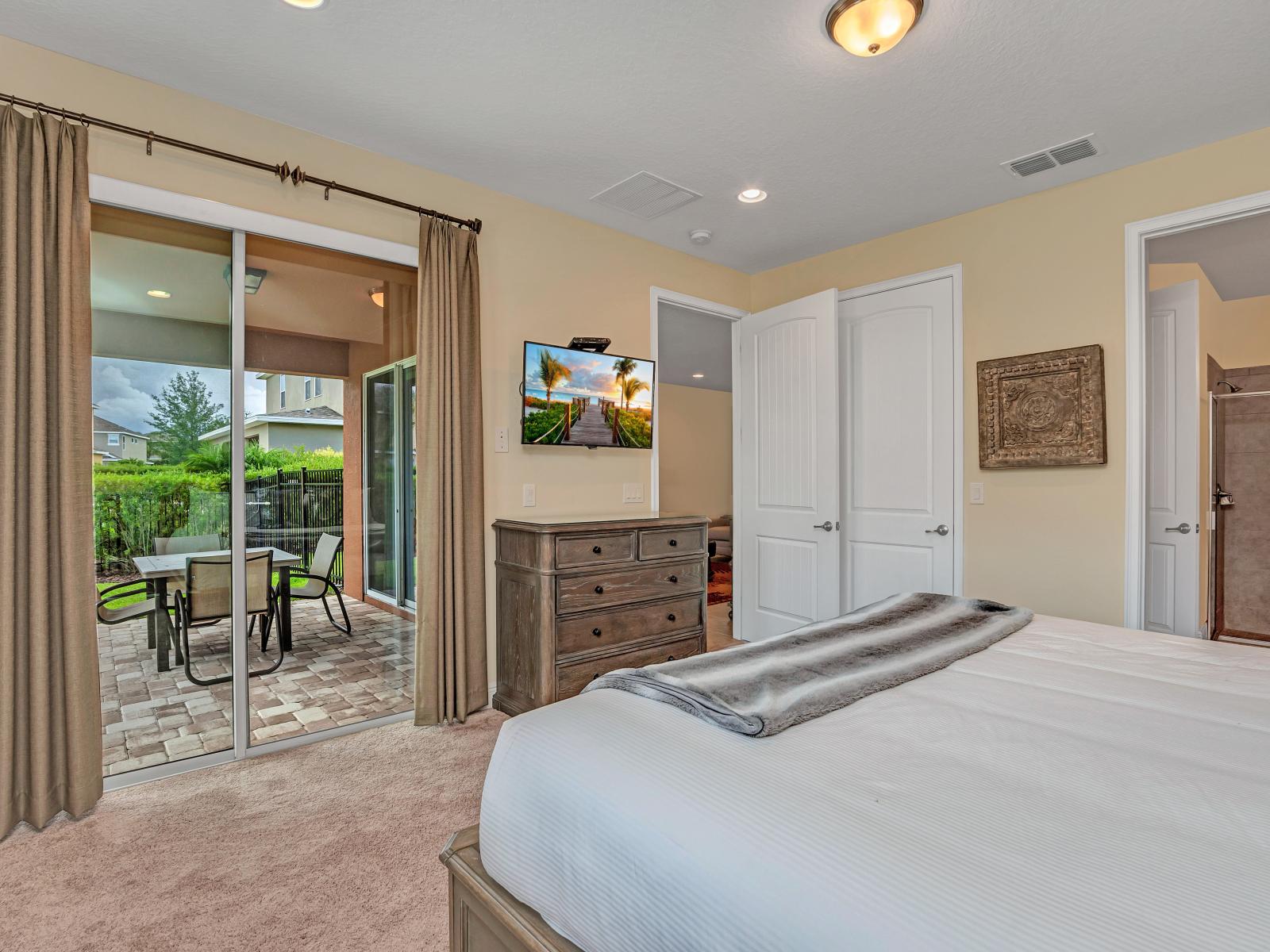 Comfy Bedroom of the Home in Kissimmee Florida - Easy access to outdoors with seating and Pool - Smart TV and Netflix - Spacious bedroom offering comfort and style